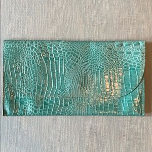Satchel. turquoise leather crocodile print clutch
